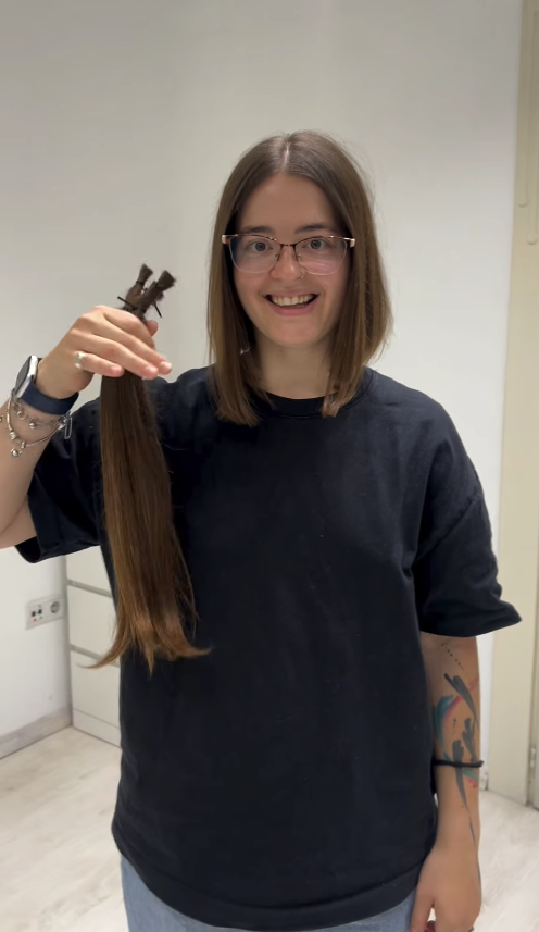 Client after selling hair and receiving a haircut